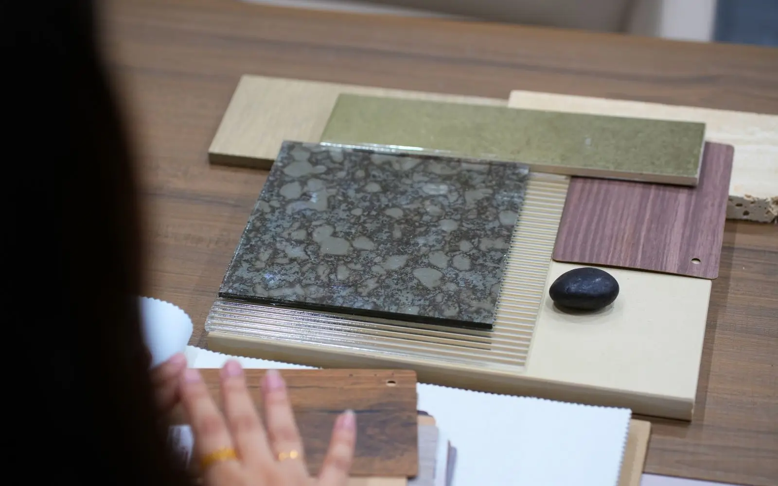 Material samples of stone, timber veneer and fabric